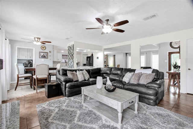 21426 Park York Dr, Katy, TX 77450 - tiled living room with ceiling fan and visible vents