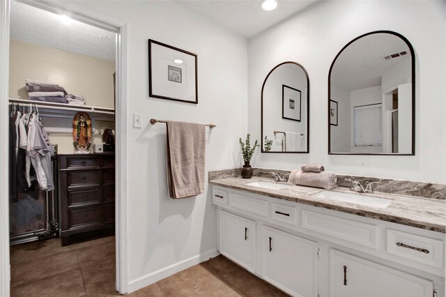 21426 Park York Dr, Katy, TX 77450 - full bath with tile patterned flooring, a sink, baseboards, and double vanity