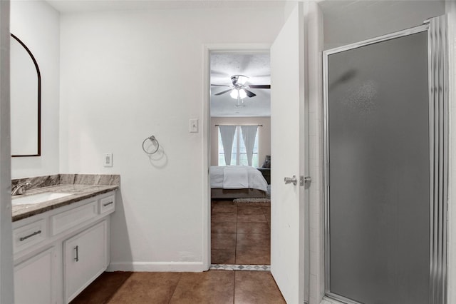21426 Park York Dr, Katy, TX 77450 - bathroom with tile patterned flooring, vanity, a shower stall, a ceiling fan, and ensuite bath