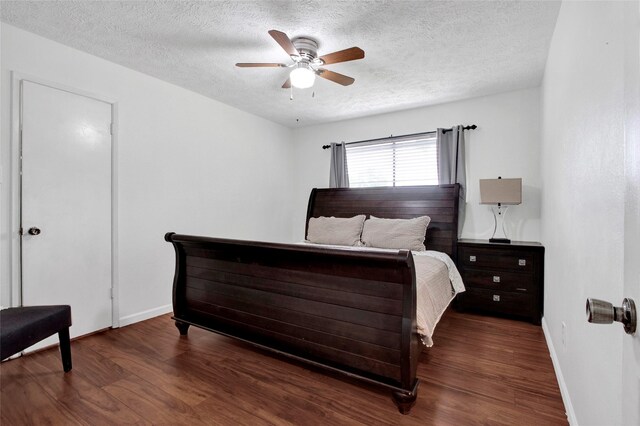 21426 Park York Dr, Katy, TX 77450 - bedroom with baseboards, a ceiling fan, a textured ceiling, and wood finished floors