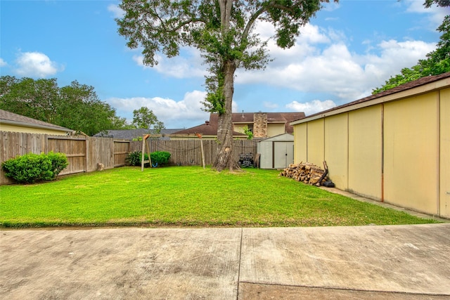 21426 Park York Dr, Katy, TX 77450 - view of yard featuring an outdoor structure, a fenced backyard, and a storage shed