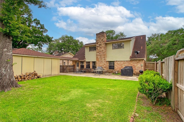 21426 Park York Dr, Katy, TX 77450 - rear view of property featuring a lawn, a patio, a chimney, and a fenced backyard