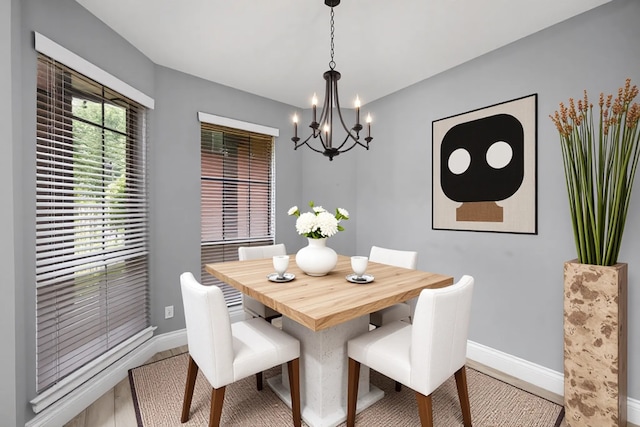 6542 Shinnecock Hills Dr, Houston, TX 77069 - dining room featuring a chandelier and baseboards