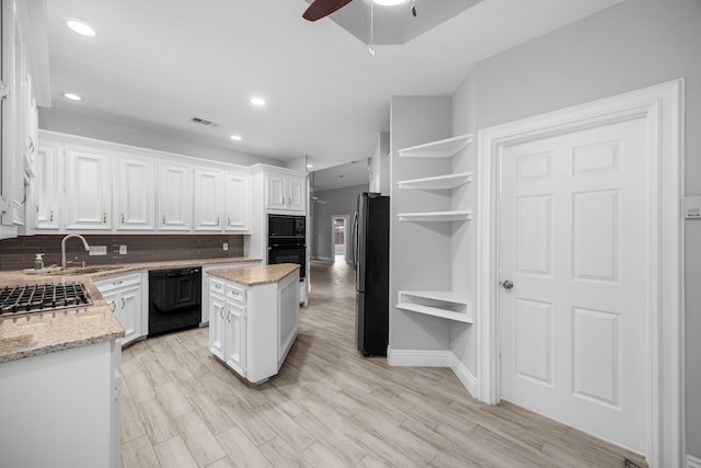 6542 Shinnecock Hills Dr, Houston, TX 77069 - kitchen featuring black appliances, open shelves, a sink, ceiling fan, and white cabinetry