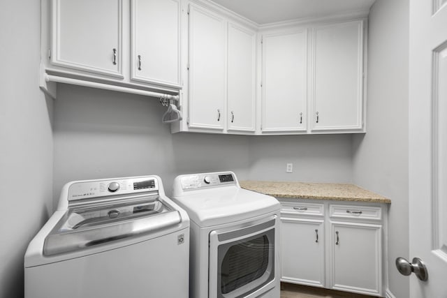 6542 Shinnecock Hills Dr, Houston, TX 77069 - laundry room featuring washer and dryer and cabinet space