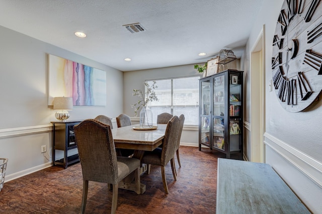 dining room with recessed lighting, baseboards, and dark wood-style flooring