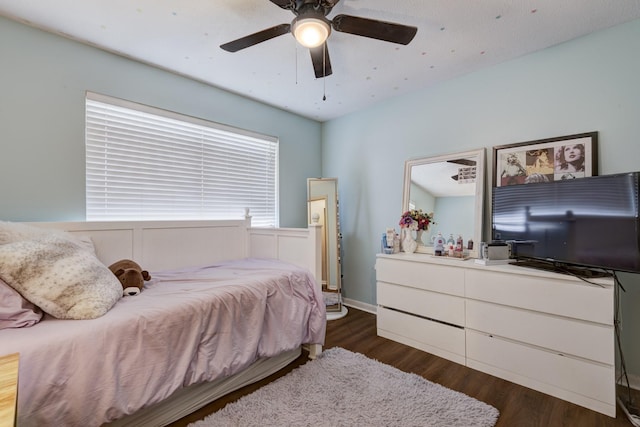 bedroom with a ceiling fan and wood finished floors