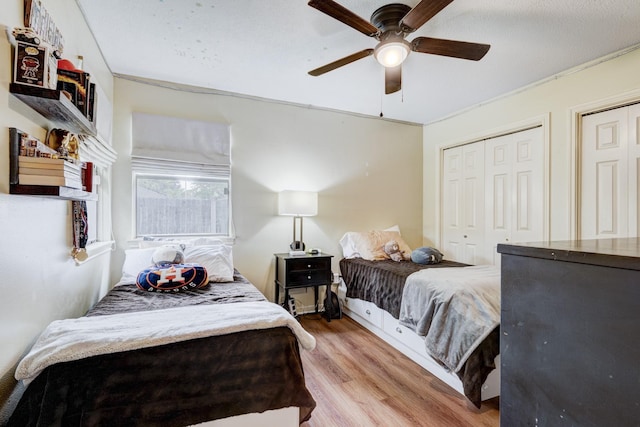 bedroom with ceiling fan and wood finished floors