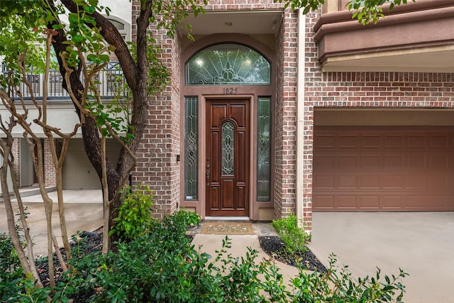 property entrance featuring brick siding