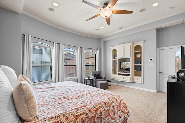 bedroom featuring baseboards, recessed lighting, crown molding, and light carpet