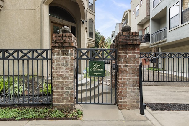 view of gate with fence
