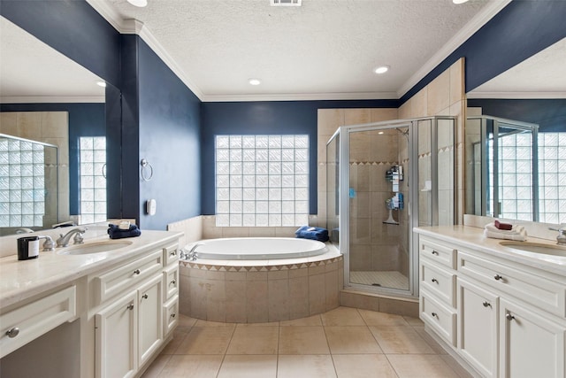 full bathroom featuring a sink, a shower stall, and a healthy amount of sunlight