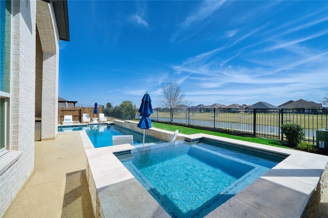 23935 Birchwood Lake Ln, Katy, TX 77493 - view of pool featuring a patio, a pool with connected hot tub, a residential view, and a fenced backyard