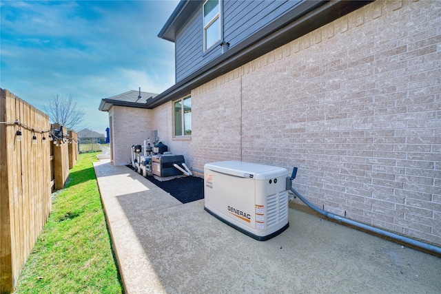 23935 Birchwood Lake Ln, Katy, TX 77493 - exterior space featuring brick siding, fence, and a power unit