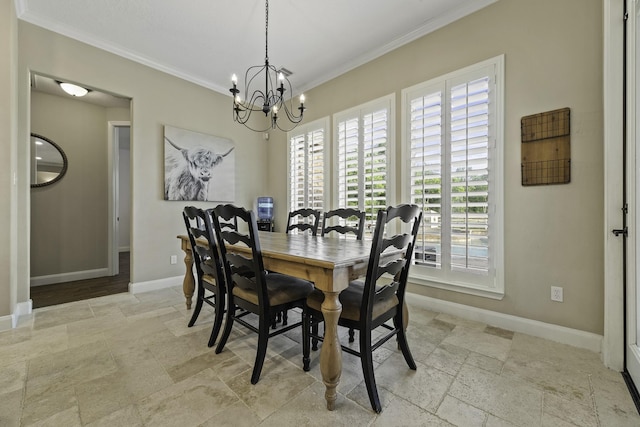 dining space with crown molding, stone tile floors, and baseboards