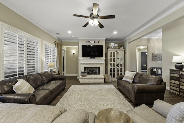 living area featuring ceiling fan, a fireplace, recessed lighting, baseboards, and dark wood-style floors