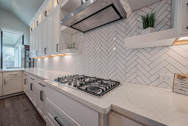2502 Forest Side Ct, Missouri City, TX 77459 - kitchen with backsplash, ventilation hood, stainless steel gas stovetop, and white cabinets
