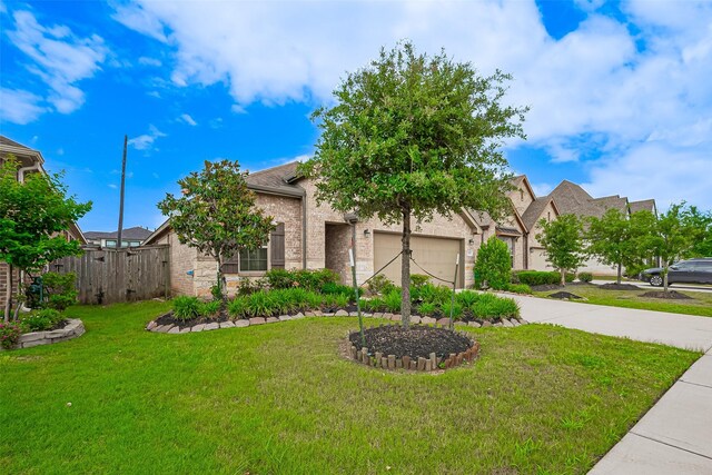 2903 Blue Mist Bnd, Brookshire, TX 77423 - view of front of property with a garage, concrete driveway, and brick siding