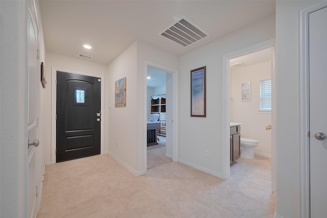 2903 Blue Mist Bnd, Brookshire, TX 77423 - entryway with light tile patterned flooring and baseboards