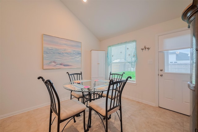 2903 Blue Mist Bnd, Brookshire, TX 77423 - dining area featuring vaulted ceiling, light tile patterned floors, and baseboards