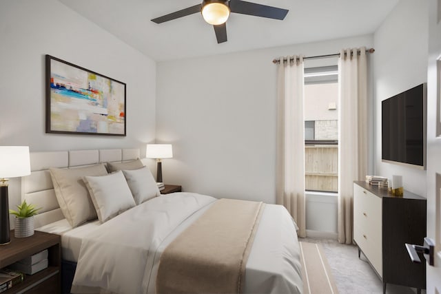 bedroom featuring ceiling fan and light carpet