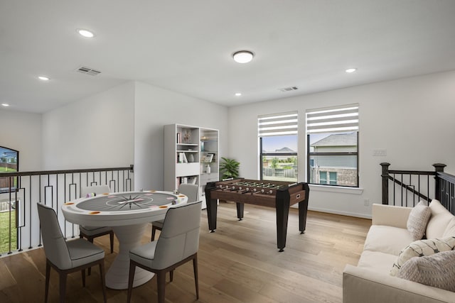 rec room featuring recessed lighting, baseboards, visible vents, and light wood finished floors