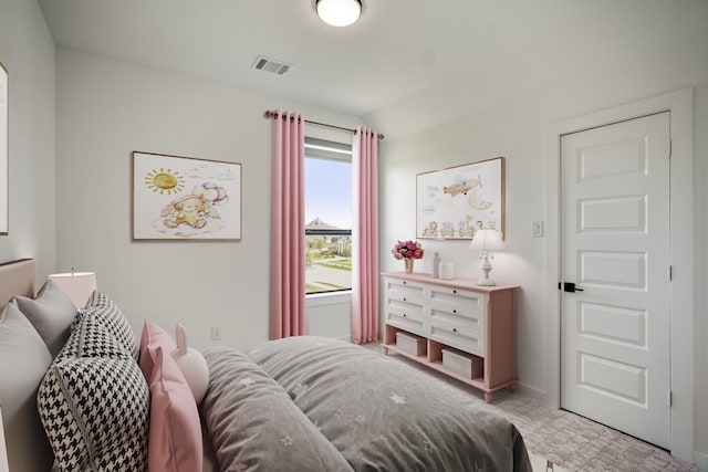 bedroom featuring visible vents