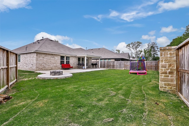 21623 Mount Frisell Ln, Porter, TX 77365 - view of yard featuring a fenced backyard, a patio, and an outdoor fire pit