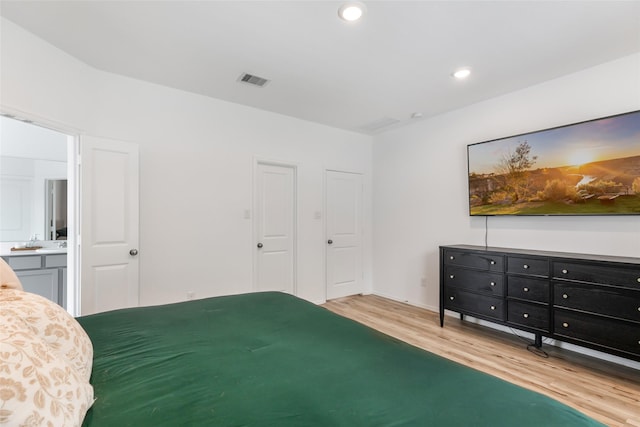 21623 Mount Frisell Ln, Porter, TX 77365 - bedroom with recessed lighting, wood finished floors, and visible vents