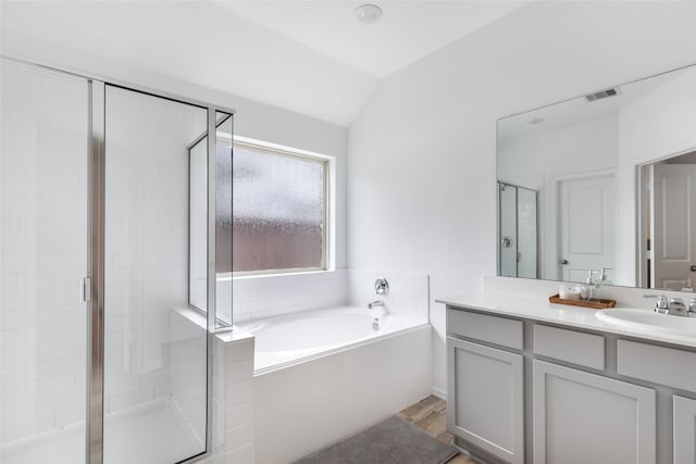 21623 Mount Frisell Ln, Porter, TX 77365 - bathroom featuring vanity, a shower stall, lofted ceiling, visible vents, and a bath