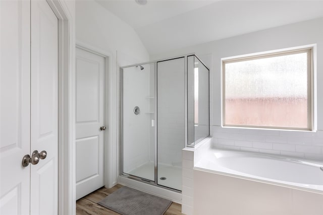 21623 Mount Frisell Ln, Porter, TX 77365 - full bathroom featuring a shower stall, lofted ceiling, a bath, and wood finished floors