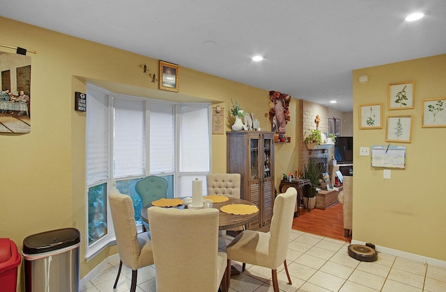 dining space featuring recessed lighting, baseboards, and light tile patterned floors