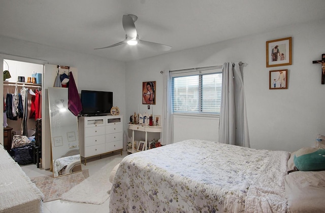 bedroom featuring ceiling fan, a spacious closet, and a closet