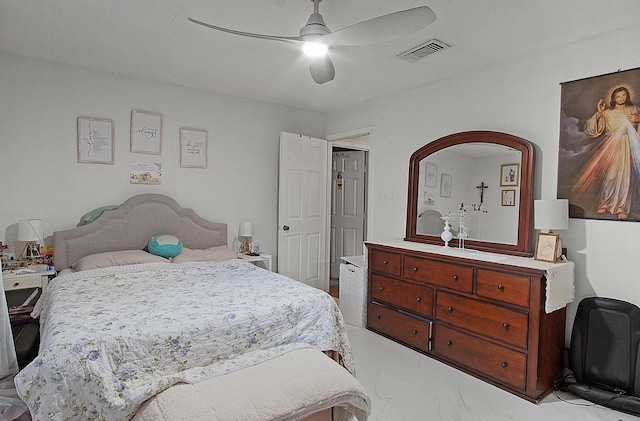 bedroom with visible vents, a ceiling fan, and marble finish floor