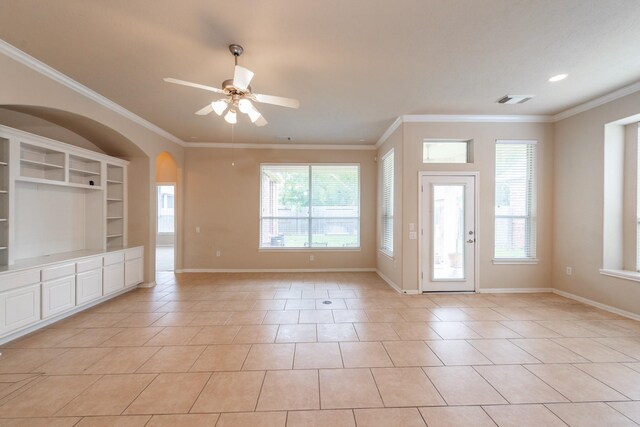unfurnished living room featuring crown molding, a ceiling fan, baseboards, light tile patterned floors, and visible vents