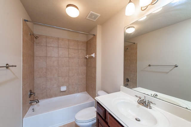 bathroom featuring toilet, visible vents, shower / washtub combination, and vanity