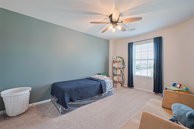 11351 Needlerock Ct, Humble, TX 77396 - carpeted bedroom with baseboards and ceiling fan