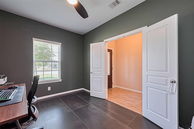 11351 Needlerock Ct, Humble, TX 77396 - home office featuring a ceiling fan and dark tile patterned flooring