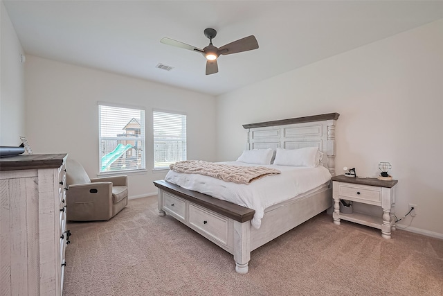 11351 Needlerock Ct, Humble, TX 77396 - bedroom featuring light carpet, baseboards, and ceiling fan