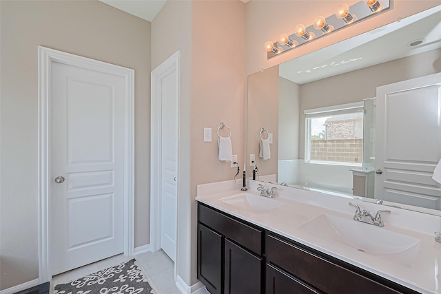 11351 Needlerock Ct, Humble, TX 77396 - full bathroom with tile patterned flooring, double vanity, and baseboards
