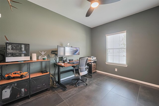 home office with baseboards and ceiling fan