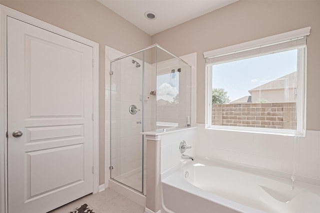 11351 Needlerock Ct, Humble, TX 77396 - full bathroom featuring a shower stall, a garden tub, and tile patterned floors