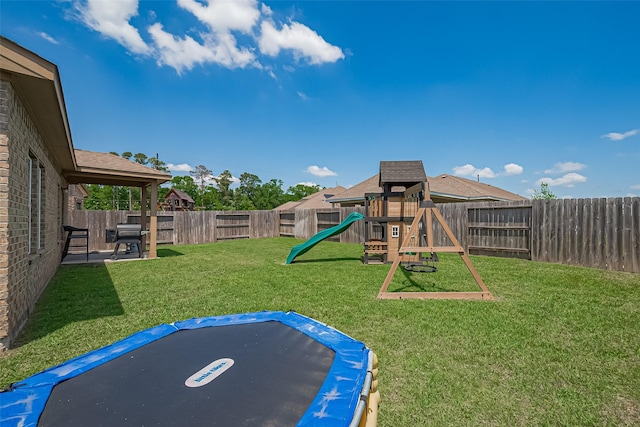 11351 Needlerock Ct, Humble, TX 77396 - view of yard featuring a trampoline and a playground
