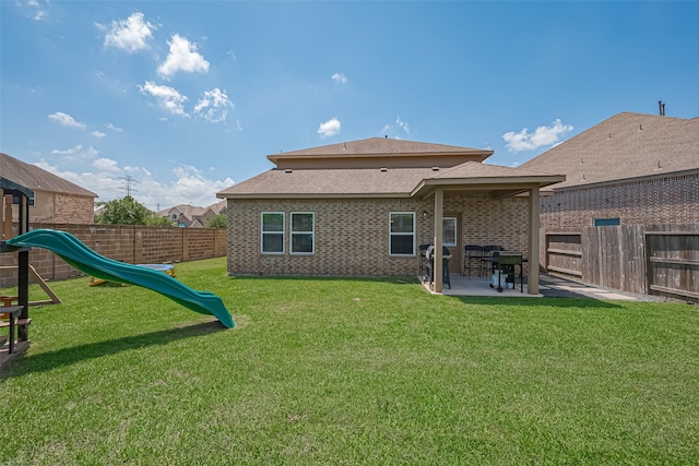 11351 Needlerock Ct, Humble, TX 77396 - rear view of house with a patio and a playground