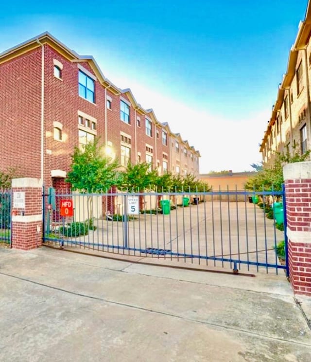 view of gate featuring fence