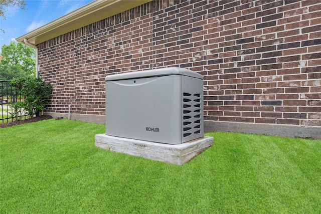 details featuring fence, a power unit, and brick siding