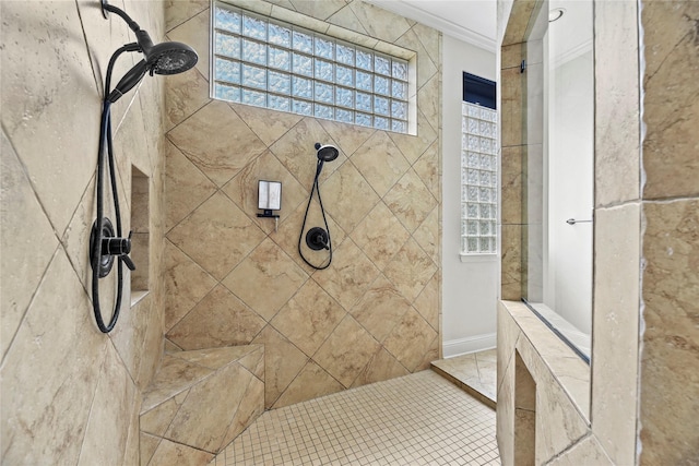full bathroom featuring ornamental molding and a tile shower