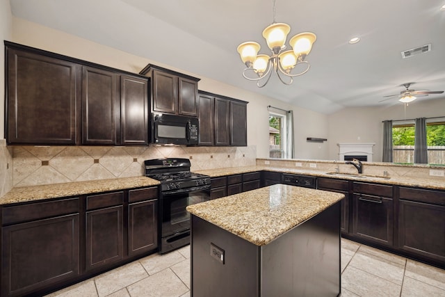 kitchen featuring visible vents, a sink, black appliances, and tasteful backsplash