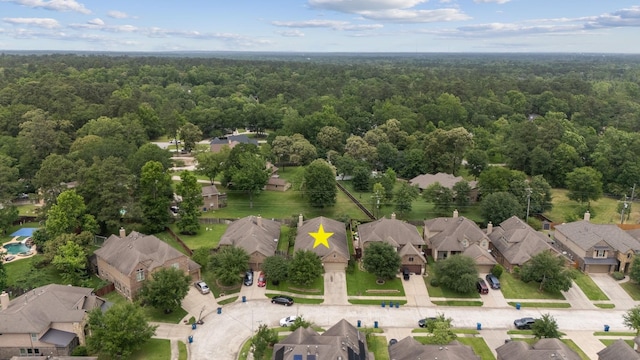 bird's eye view with a residential view and a forest view
