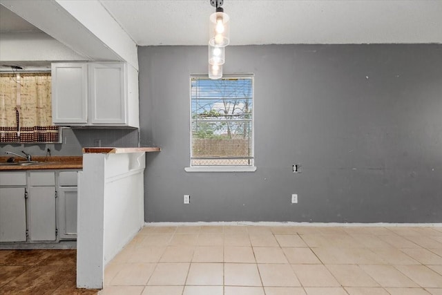 6201 Batterson St, Houston, TX 77026 - unfurnished dining area featuring baseboards